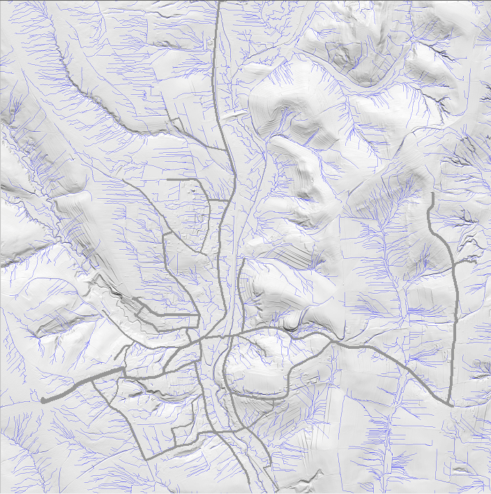 3D-Geländemodell einer gebirgigen Region mit Flüssen und Straßen, zeigt topografische Details und Höhenunterschiede.